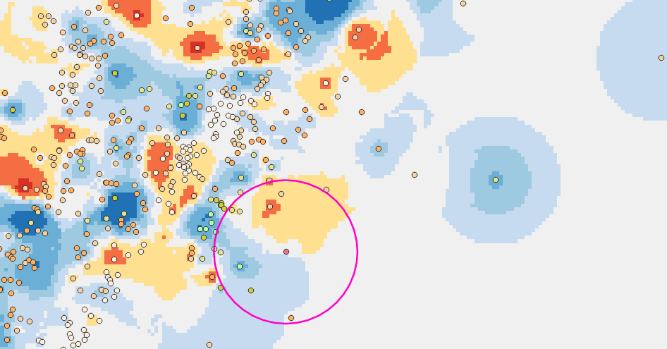 A larger view of the grid of dots with the search radius marked and gradient data (red to dark blue). The center point is light blue.. 